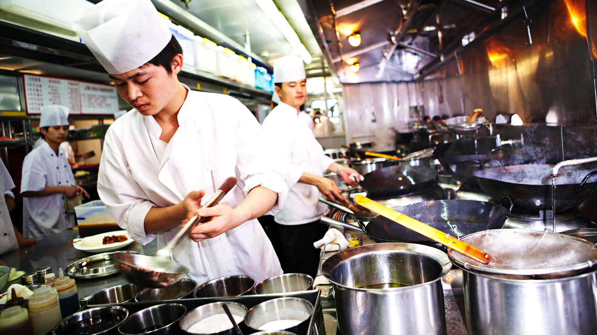 Chefs prepare meals using Unilever products